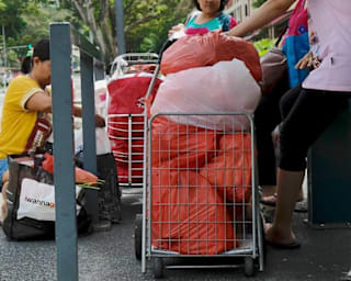 Supermarket plastic bag charge raises millions of dollars, but questions emerge over fund usage