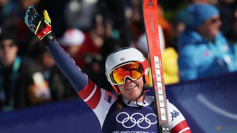 Alpine skiing-Johnson wins downhill after big crash for teammate Vonn