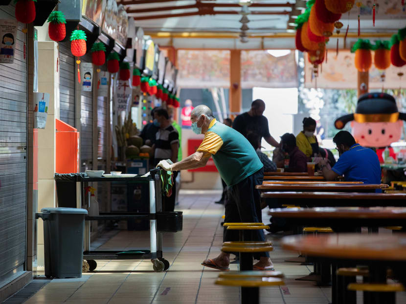 A cleaner working at Maxwell Food Centre on Feb 11, 2021.