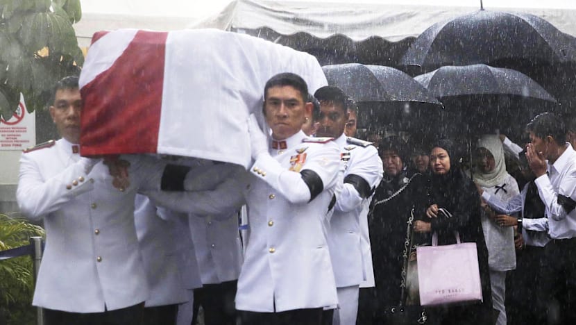 Crowds brave torrential downpour as Othman Wok is laid to rest