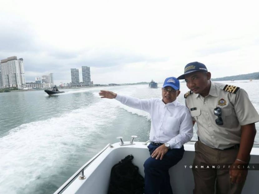 Johor chief minister Osman Sapian (left) aboard the MV Pedoman.
