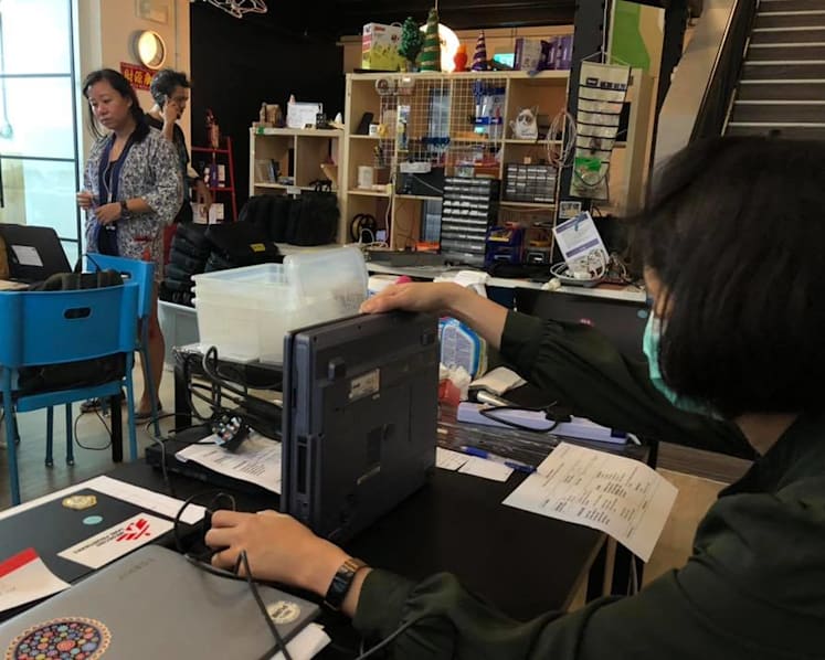 Heroes Unmasked: They fix donated laptops to give to students from low-income families for home-based learning