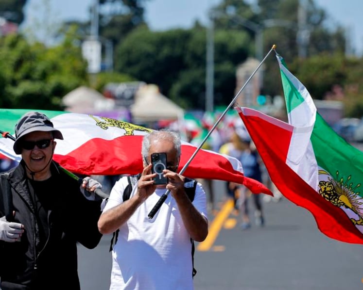 Iranian American protesters gather as soccer team prepare for World Cup opener
