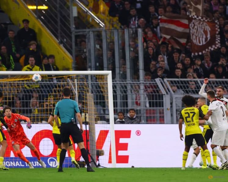 Dortmund waste two-goal lead but score stoppage-time win over St Pauli