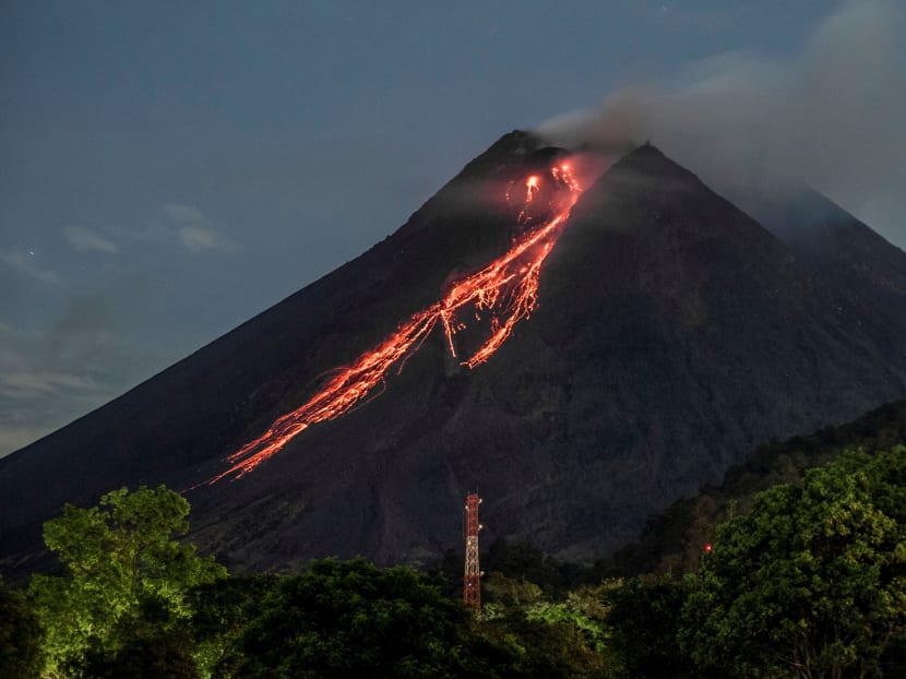 Lava flows down from the crater of Mount Merapi as seen from Kaliurang, in Yogyakarta on February 19, 2021. Lava flows down from the crater of Mount Merapi as seen from Kaliurang, in Yogyakarta on February 19, 2021.