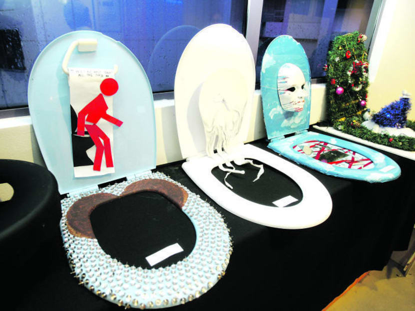 Students painted toilet seats to celebrate World Toilet Day on Nov 19, 2008. TODAY file photo