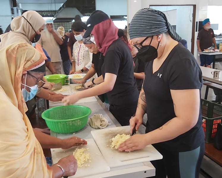 'It’s beautiful to see everyone working in harmony': Malaysia volunteers out in force to aid flood victims