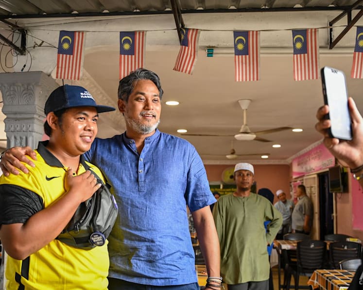 A day on the campaign trail: Aspiring PM Khairy fights for political survival in Sungai Buloh 