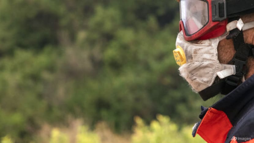 Strong wind complicates fighting wildfire in southeast Spain