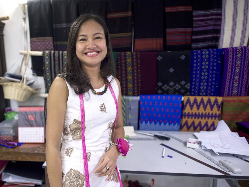 Boutique owner Pyone Thet Thet Kyaw, owner and designer of Virya Couture, at her shop at Yangon. With Myanmar emerging as a manufacturing hub for mass-produced clothes, a crop of young designers are using home-grown fashion to preserve the country's sartorial heritage and reshape the sweatshop model. Photo: AFP