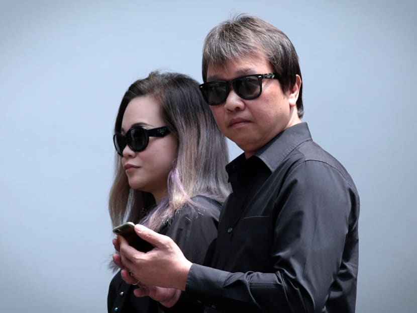 Larry Tan Chin Guan (right), charged for releasing three Motoro stingrays at Lower Seletar Reservoir, arrives at the State Courts on 26 Sept, 2017. Photo: Jason Quah