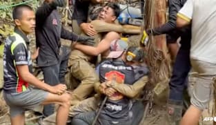 Survivors advise rescuers in search for last two stuck in Laos cave