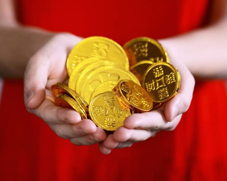 Commentary: Don’t stash your child’s hongbao money in the bank. Give them a chance to spend it