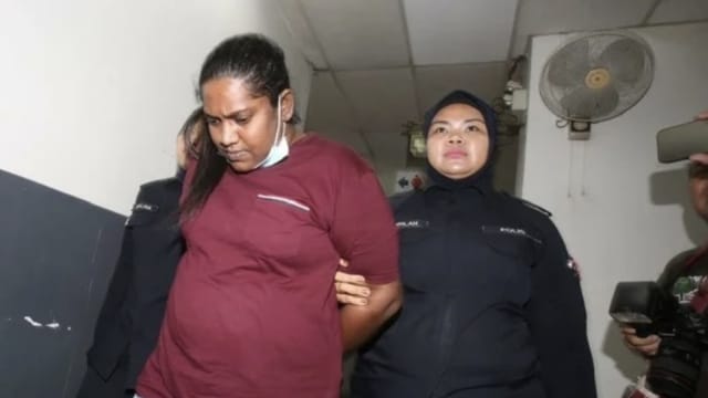 从狮城引偷渡客至新山 人贩集团女首脑马国面控