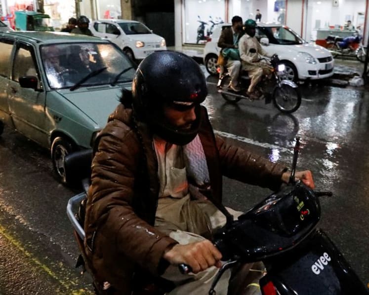 Pakistan commuters switch to EV scooters as petrol prices soar