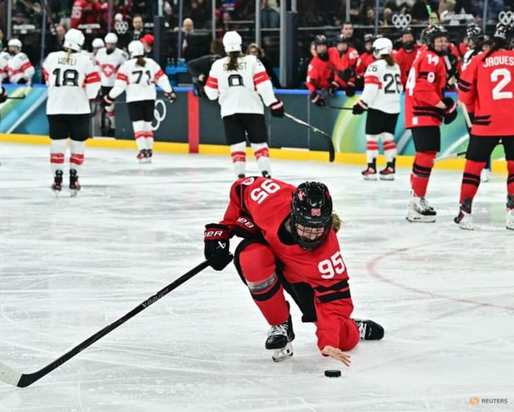 Ice hockey-Canada look to captain Poulin in title defence after goal-scoring record