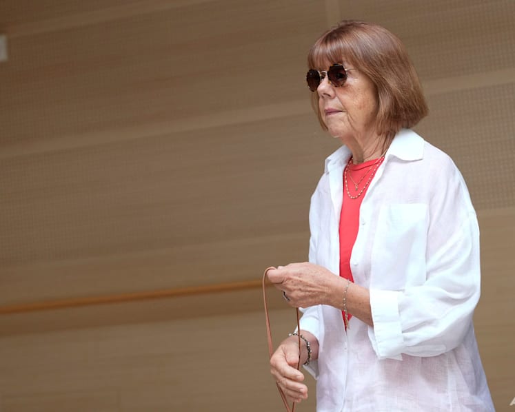 French woman whose husband is accused of inviting men to rape her testifies in court