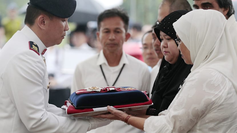 Crowds brave torrential downpour as Othman Wok is laid to rest