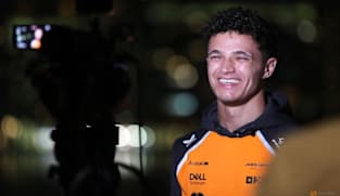 Norris gets his hands on F1 trophy as unwell Verstappen stays away