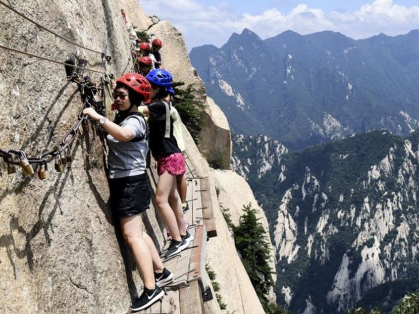 Visitors must rent safety harnesses which they attach to guide ropes that run along the section of cliff.
