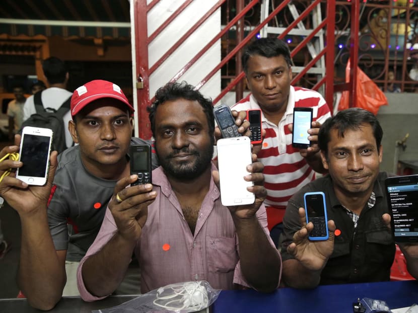 450 needy foreign workers set to get new phones ahead of 3G shift