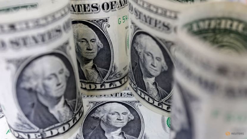 Dollar retreats with markets focused on US data, shrugging off Venezuela