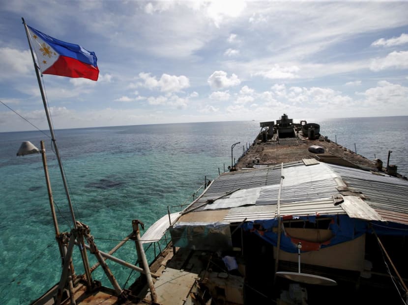 A Philippine flag flutters from BRP Sierra Madre, a dilapidated Philippine Navy ship that has been aground since 1999 and became a Philippine military detachment on the disputed Second Thomas Shoal, part of the Spratly Islands, in the South China Sea on March 29, 2014. A Philippine flag flutters from BRP Sierra Madre, a dilapidated Philippine Navy ship that has been aground since 1999 and became a Philippine military detachment on the disputed Second Thomas Shoal, part of the Spratly Islands, in the South China Sea on March 29, 2014.