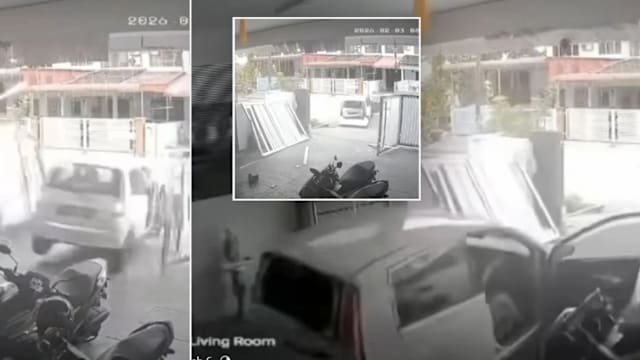 疑误踩油门闯祸  马国司机倒车失控撞毁邻居大门