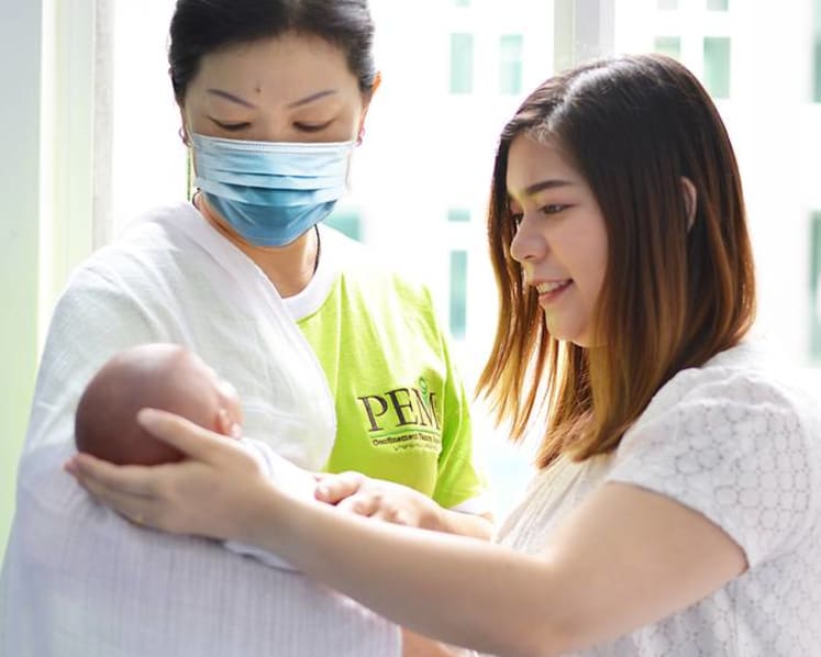 Fewer Malaysian confinement nannies in Singapore due to COVID-19, parents face higher costs in hiring