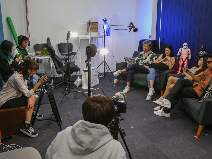 (Fourth from right) Mr Johnathan Chua, seen here on set during a filming session for one of the episodes of the online talk show, Real Talk. (Fourth from right) Mr Johnathan Chua, seen here on set during a filming session for one of the episodes of the online talk show, Real Talk.