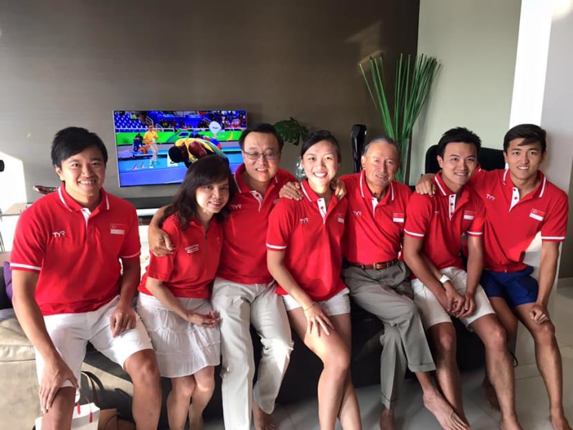 Colin Schooling (3rd from right) sits with family and friends ready to watch the 100m butterfly final on Saturday (Aug 13). Photo: Adelene Wong Colin Schooling (3rd from right) sits with family and friends ready to watch the 100m butterfly final on Saturday (Aug 13). Photo: Adelene Wong