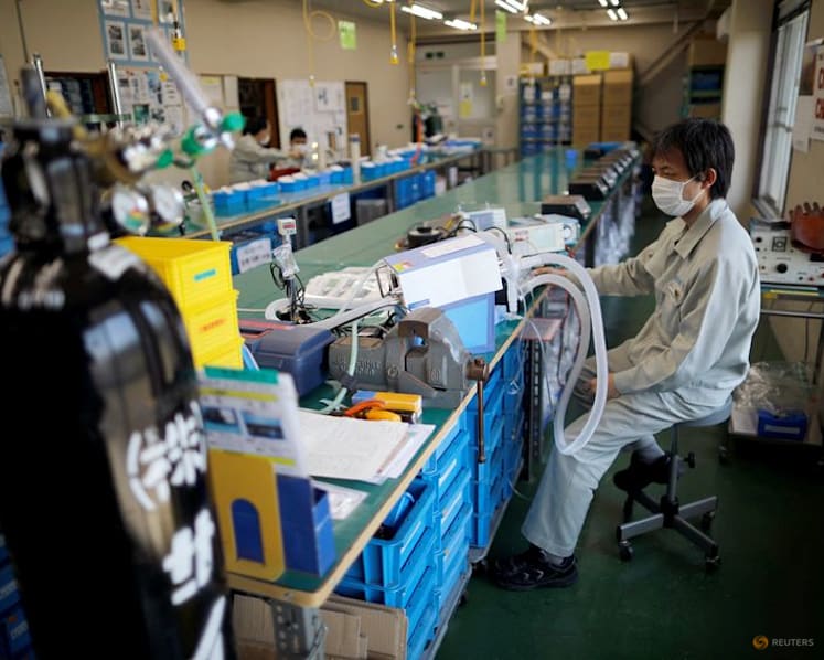 Japan manufacturers stay upbeat on chip demand, services hit by costs