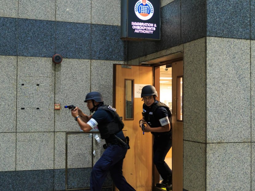 A practice operation held by the Immigration and Checkpoints Authority, where its officers have to engage "gunmen" at a checkpoint. A practice operation held by the Immigration and Checkpoints Authority, where its officers have to engage "gunmen" at a checkpoint.