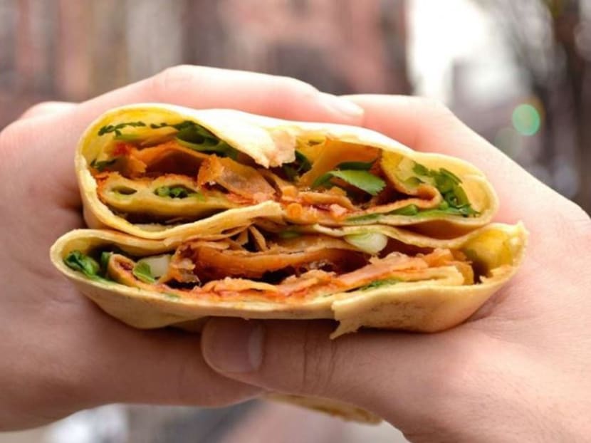 The breakfast favourite, which usually contains spring onion, coriander, egg and a crispy cracker, is now being sold by companies in London, Sydney and a handful of American cities. Photo: South China Morning Post