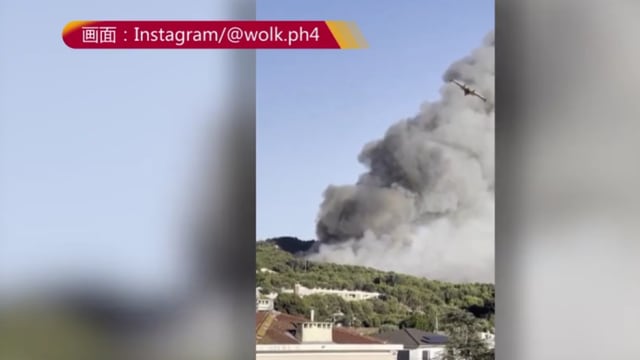西班牙首都马德里受附近林火影响 城市上空被浓烟笼罩