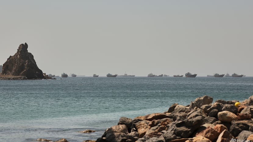 Singapore-registered ship hit by projectile in Strait of Hormuz, crew members safe