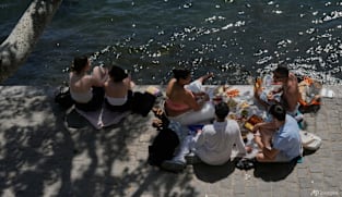 Parts of Europe swelter in record May heat as deaths at amateur sports events spur warnings