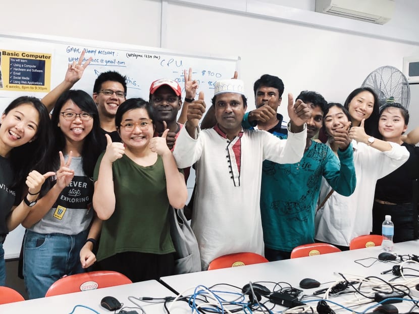 The author (far left) at a monthly Migrant x Me learning journey where members of the public get to interact with migrant workers.