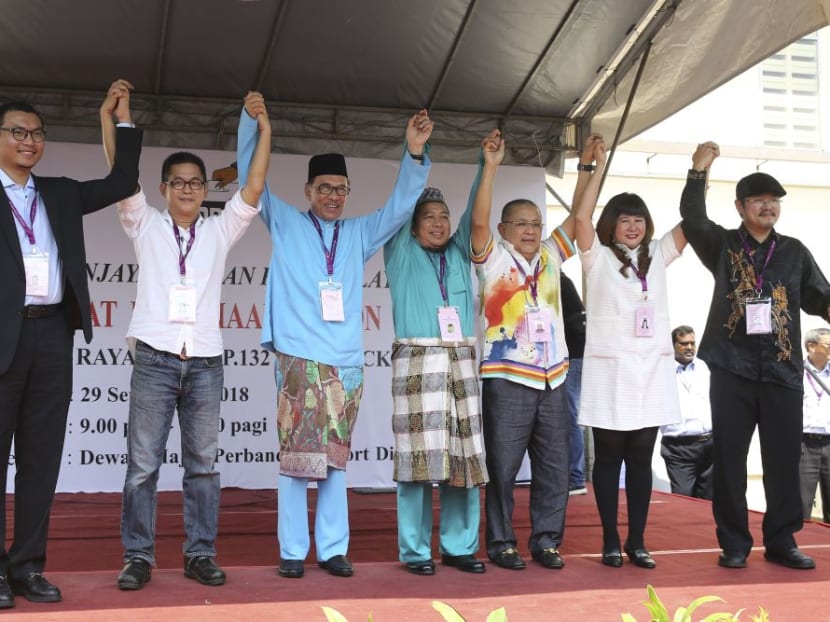 PKR incoming president Datuk Seri Anwar Ibrahim (third from left) poses for a photo with the other candidates at the nomination centre in Port Dickson, Negeri Sembilan. PKR incoming president Datuk Seri Anwar Ibrahim (third from left) poses for a photo with the other candidates at the nomination centre in Port Dickson, Negeri Sembilan.