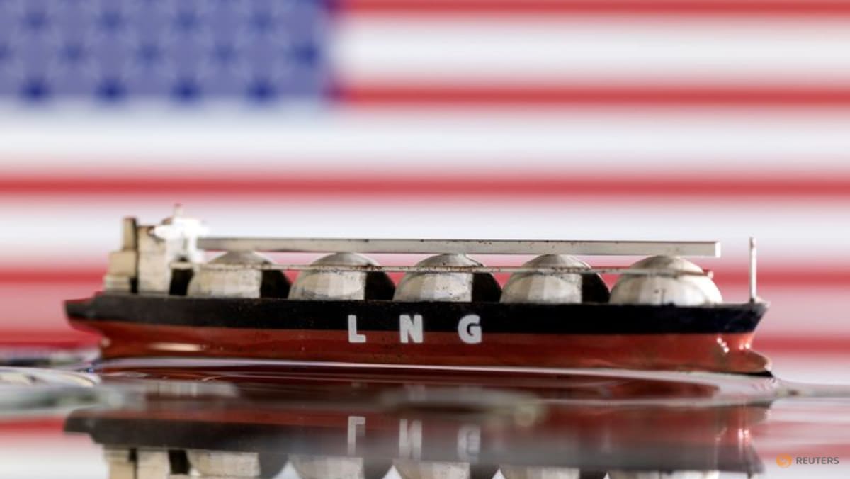 Model of LNG tanker is seen in front of the U.S. flag in this illustration taken May 19, 2022. REUTERS/Dado Ruvic/Illustration