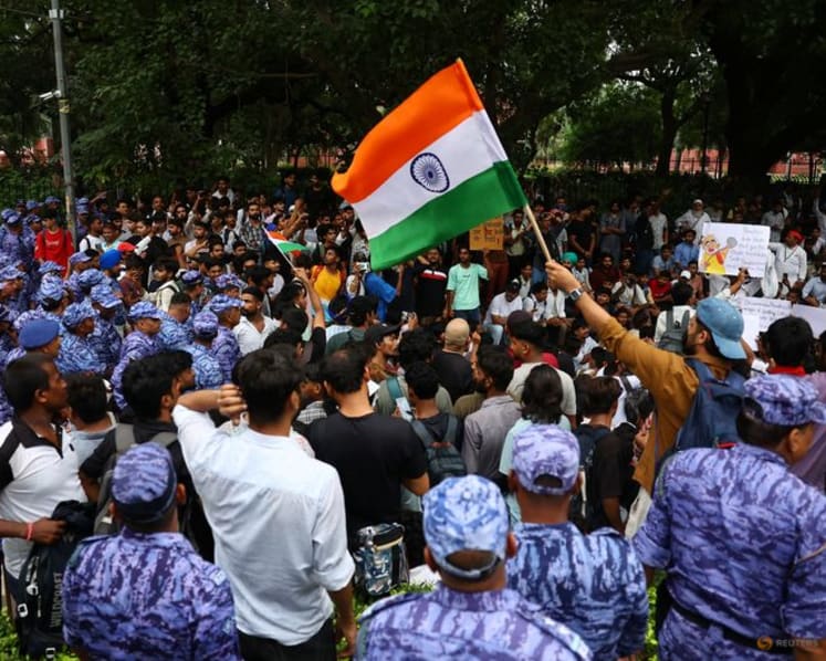 Indian police fire tear gas at exam protest march