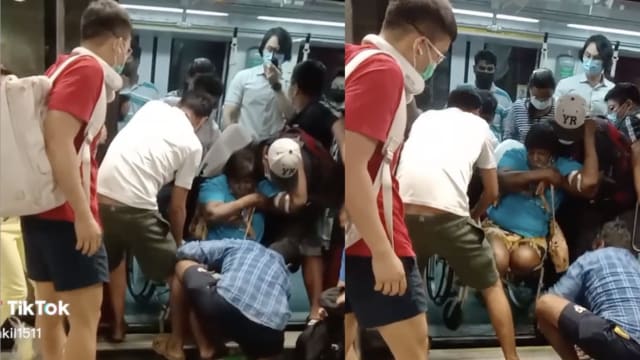 截肢妇轮椅卡地铁月台缝隙 热心乘客齐力帮忙