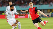 Austria fight back from early red card to beat Tunisia