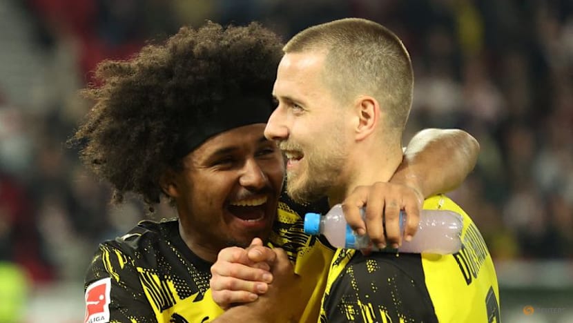 Dortmund score twice in stoppage time to beat Stuttgart 2-0