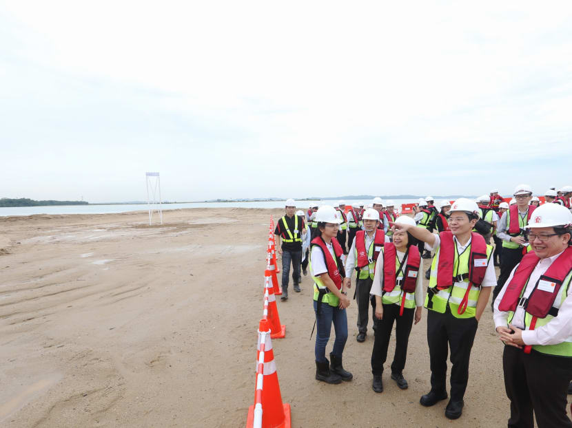 From right to left: Mr Yap Tiem Yew, Group Director of Building & Infrastructure, HDB; Mr Lawrence Wong, Minister for National Development and Second Minister for Finance; and Dr Cheong Koon Hean, CEO, HDB, seen during the visit to the polder site at Pulau Tekong on Nov 16, 2016. Photo: Koh Mui Fong/TODAY From right to left: Mr Yap Tiem Yew, Group Director of Building & Infrastructure, HDB; Mr Lawrence Wong, Minister for National Development and Second Minister for Finance; and Dr Cheong Koon Hean, CEO, HDB, seen during the visit to the polder site at Pulau Tekong on Nov 16, 2016. Photo: Koh Mui Fong/TODAY