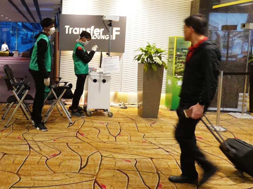 The body temperature of travellers are displayed on a monitor at one of several scanning posts in Changi Airport during the Covid-19 outbreak. The body temperature of travellers are displayed on a monitor at one of several scanning posts in Changi Airport during the Covid-19 outbreak.