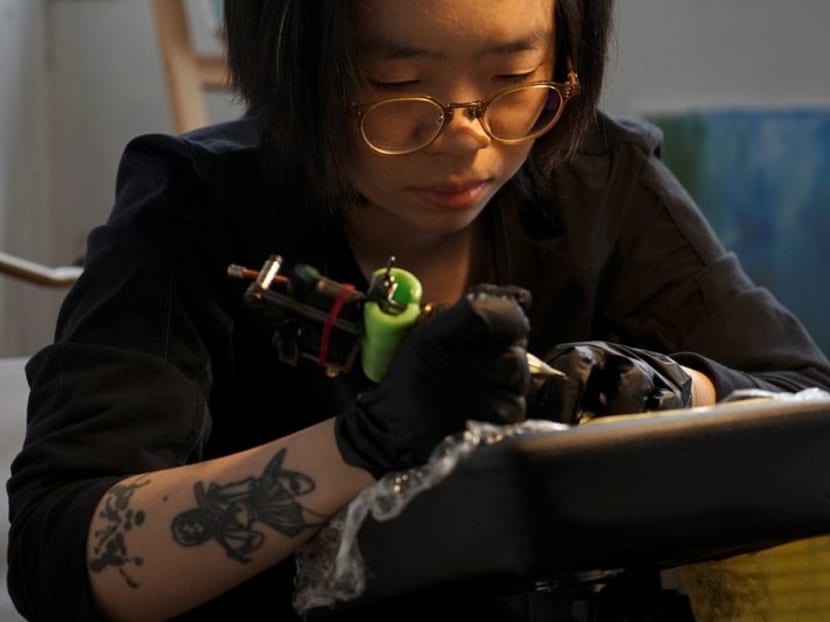 Ms Chu Yi, 23, practises tattooing for a six-month apprenticeship to be a tattoo artist, at her home on the outskirts of Shanghai, China on Jan 29, 2024. Ms Chu Yi, 23, practises tattooing for a six-month apprenticeship to be a tattoo artist, at her home on the outskirts of Shanghai, China on Jan 29, 2024.