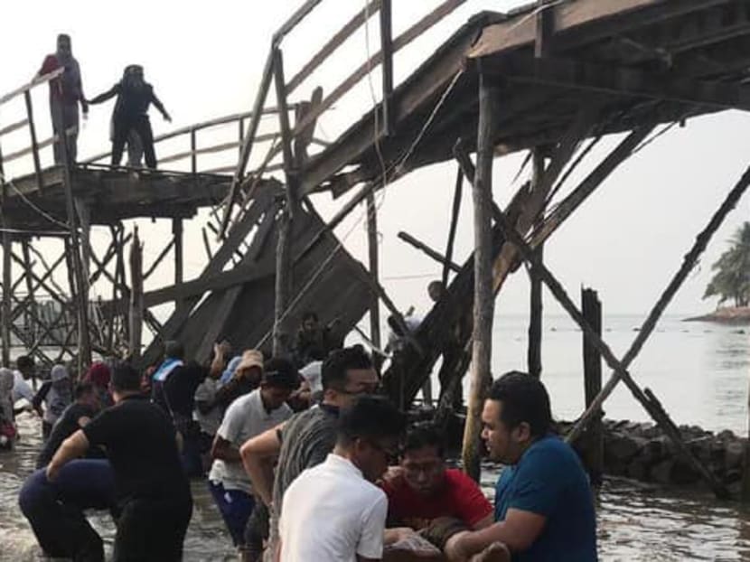 Indonesian media outlet Sindonews.com reported that the Singaporean tourists were taking selfies on the 70m-long wooden bridge at the Montigo Bay Resorts in Nongsa, Batam, when it collapsed in the middle. Indonesian media outlet Sindonews.com reported that the Singaporean tourists were taking selfies on the 70m-long wooden bridge at the Montigo Bay Resorts in Nongsa, Batam, when it collapsed in the middle.