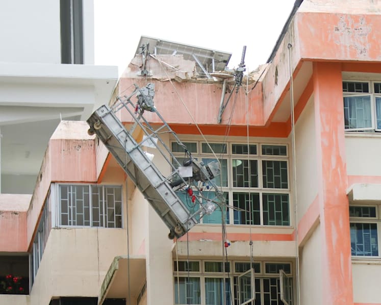 Two workers taken to hospital after gondola tips to one side at Boon Lay Drive HDB block