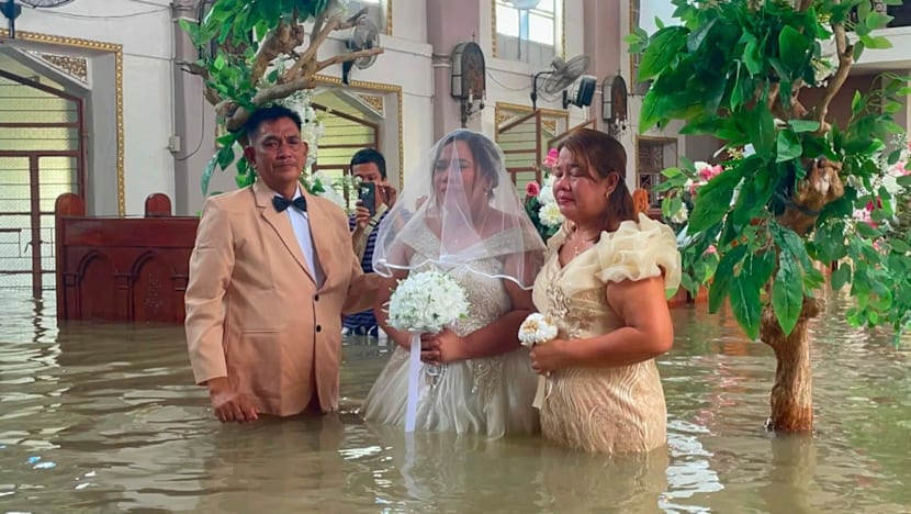 Philippine couple married in hip-deep floodwaters